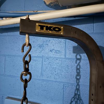 LOT 86: TKO Commercial Heavy Bag Stand w/ TKO 100lb Pro Style Heavy Bag