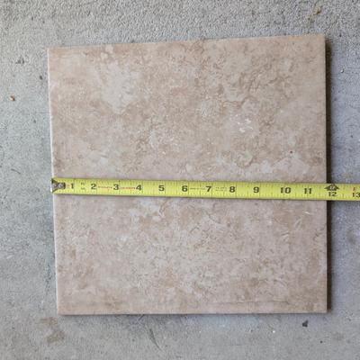 LOT 109G: Large Assortment of Porcelain Tiles 12 X 12 & Open Containers of Tile Adhesive