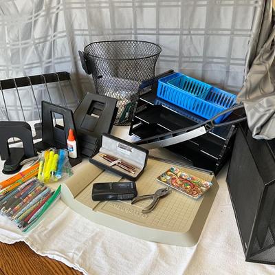 Office supplies including the paper cutter.