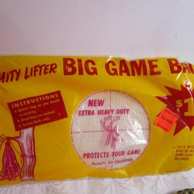 2 Big game bags, new Vinyl Poncho, vinyl vest, 15' dog chain, bungie cord