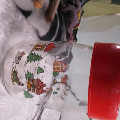Drum sticks, antenna, lap blanket, lighter, bag, vintage can, plastic decorative jar