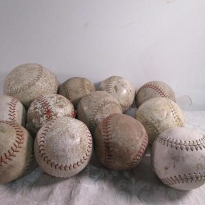 12 softballs (one is bigger)