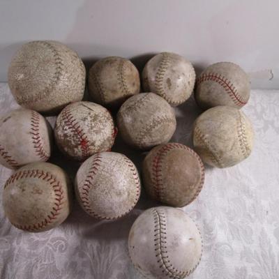 12 softballs (one is bigger)