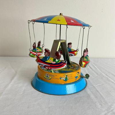 D878 Vintage Children's Carousel Tin Toy