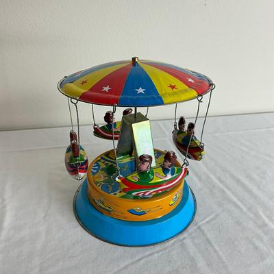 D878 Vintage Children's Carousel Tin Toy