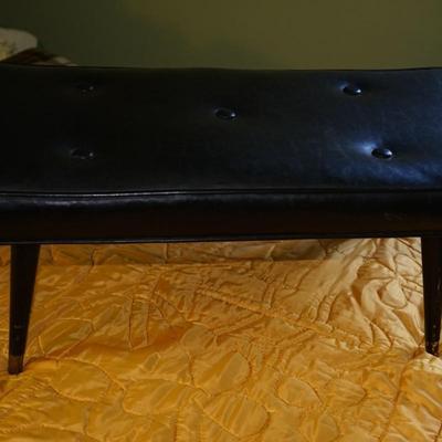 VINTAGE EARLY 70'S BLACK VINYL (BUTTON TUFT) BENCH W/ WOOD LEGS/BRASS CAPS.
