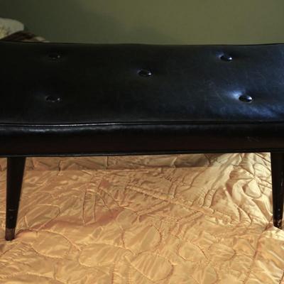 VINTAGE EARLY 70'S BLACK VINYL (BUTTON TUFT) BENCH W/ WOOD LEGS/BRASS CAPS.