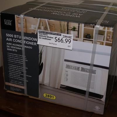 NIB 5000BTU WINDOW AIR CONDITIONER. - NEVER OPENED.