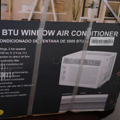 NIB 5000BTU WINDOW AIR CONDITIONER. - NEVER OPENED.