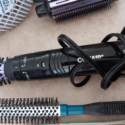 HAIR CARE ITEMS AND A SMALL ELECTRIC RAZOR