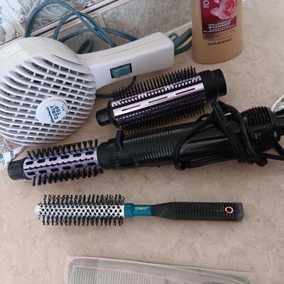 HAIR CARE ITEMS AND A SMALL ELECTRIC RAZOR