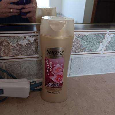 HAIR CARE ITEMS AND A SMALL ELECTRIC RAZOR