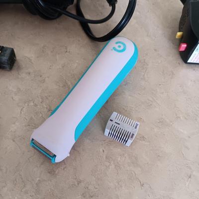 HAIR CARE ITEMS AND A SMALL ELECTRIC RAZOR