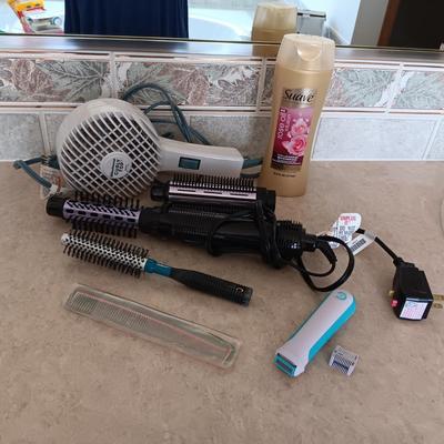 HAIR CARE ITEMS AND A SMALL ELECTRIC RAZOR