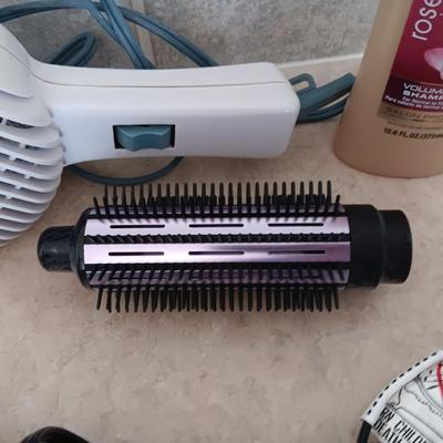 HAIR CARE ITEMS AND A SMALL ELECTRIC RAZOR