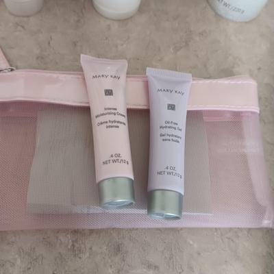 MARY KAY SATIN HANDS AND SOME SAMPLES PLUS A MAKEUP BAG AND BRUSH