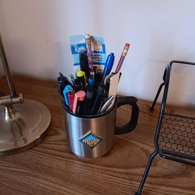 A SIMPLE WRITING DESK WITH LAMP, ETC AND A DESK CHAIR WITH 3 DIFFERENT ADJUSTMENTS