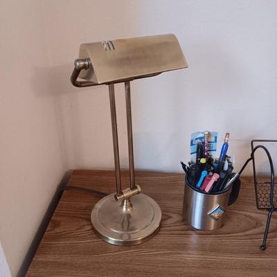 A SIMPLE WRITING DESK WITH LAMP, ETC AND A DESK CHAIR WITH 3 DIFFERENT ADJUSTMENTS