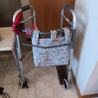 DOUBLE SHOWER SEAT, FOLDING WALKER, BED ASSIST AND A HEATING PAD