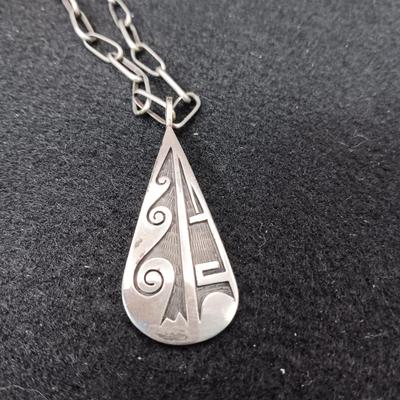 STERLING SILVER PENDANT ON A CHAIN AND A STERLING BRACELET 45.52g