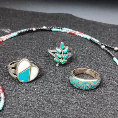 HAND BEADED NECKLACE WITH A POUCH AND 3 STERLING SILVER RINGS SIZES 5 & 6