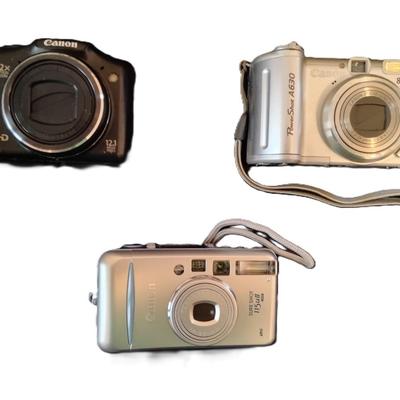 3 Cannon Cameras w/case and tripod