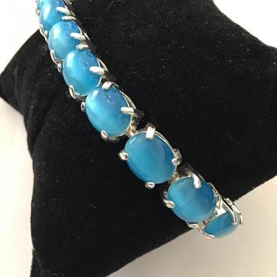 Cute silver toned tennis bracelet MoonGlow blue faux stone