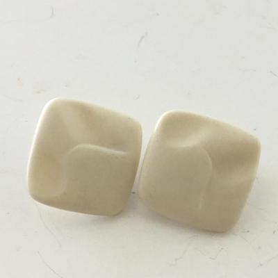 Unmarked vintage white clip on earrings