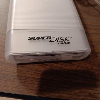 SUPERDISK USB DRIVE FOR MACINTOSH, 3 DRAWER ORGANIZER AND A SAMSUNG FLIP PHONE