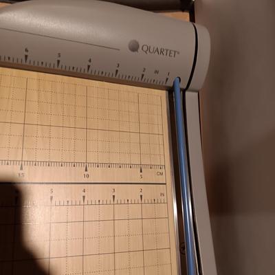 VERY NICE QUARTET PAPER CUTTER, DRAW FULL OF COPY PAPER AND DESK ORGANIZERS