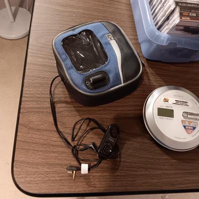 MUSIC ON CD'S, SONY WALKMAN CD PLAYER WITH REMOTE, EARBUDS, DISC HOLDER AND SOME 45'S RECORDS