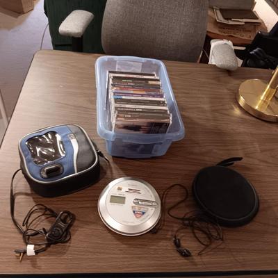 MUSIC ON CD'S, SONY WALKMAN CD PLAYER WITH REMOTE, EARBUDS, DISC HOLDER AND SOME 45'S RECORDS