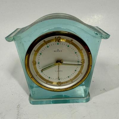 Sale Photo Thumbnail #58: 1 Jewel wind-up alarm clock. Pale blue lucite case. Approx. 3.5" tall, made by Rensie Watch Company is US Occupied Germany. Tested, clock and alarm function as expected.
