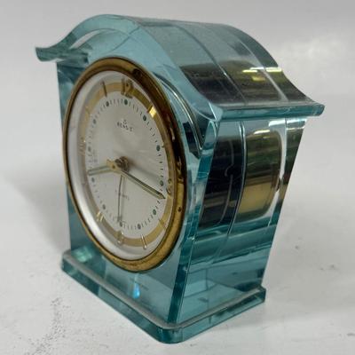 Sale Photo Thumbnail #56: 1 Jewel wind-up alarm clock. Pale blue lucite case. Approx. 3.5" tall, made by Rensie Watch Company is US Occupied Germany. Tested, clock and alarm function as expected.