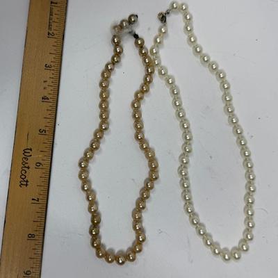 Sale Photo Thumbnail #557: Cream colored pearls have a clasp, but the baroque one does not have a clasp.