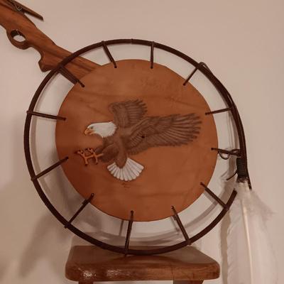ARTWORK DONE ON LEATHER, WOODEN TOY RIFLE AND COFFEE TABLE BOOK