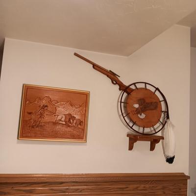 ARTWORK DONE ON LEATHER, WOODEN TOY RIFLE AND COFFEE TABLE BOOK
