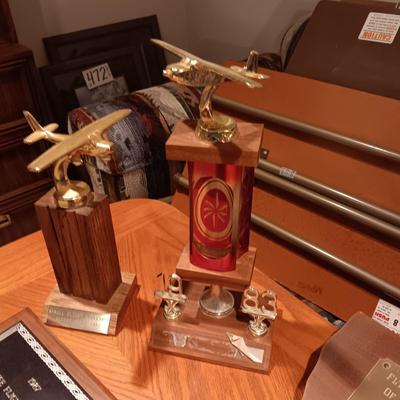 LEATHER PILOT CAP, TROPHIES AND NEWS ARTICLES REGARDING THE FATHER OF 2 SISTERS