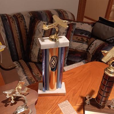 LEATHER PILOT CAP, TROPHIES AND NEWS ARTICLES REGARDING THE FATHER OF 2 SISTERS