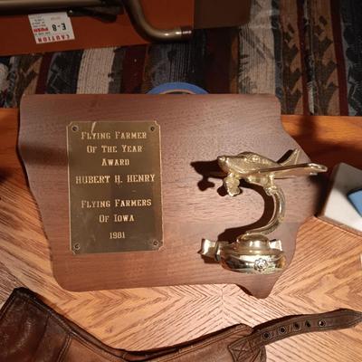LEATHER PILOT CAP, TROPHIES AND NEWS ARTICLES REGARDING THE FATHER OF 2 SISTERS