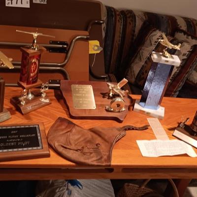LEATHER PILOT CAP, TROPHIES AND NEWS ARTICLES REGARDING THE FATHER OF 2 SISTERS