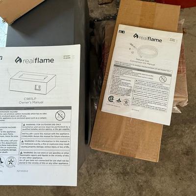 Brand new, never used Real Flame gas fire table. Retails for over $900