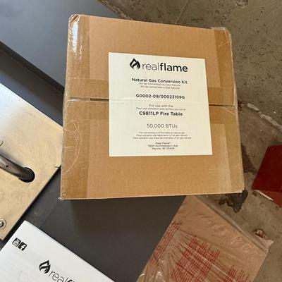 Brand new, never used Real Flame gas fire table. Retails for over $900