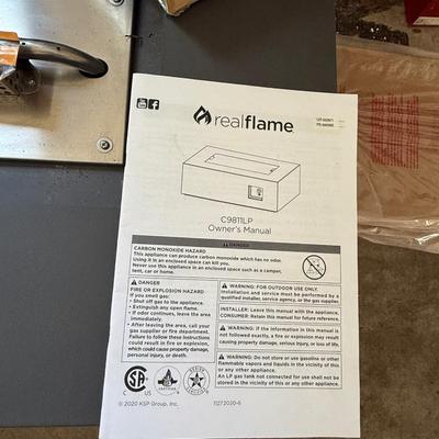 Brand new, never used Real Flame gas fire table. Retails for over $900