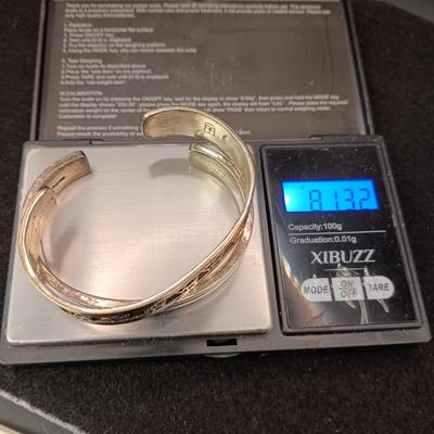 2 STERLING SILVER CUFF BRACELETS (1 IS SIGNED ARTIE YELLOWHORSE) 81.32g