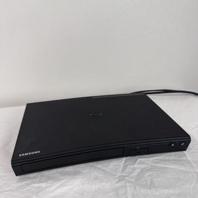 Samsung BD-J5700 Blue-Ray Player, GPX DVD/CD Player DH300B, and Several DVDs (B1-DZ)