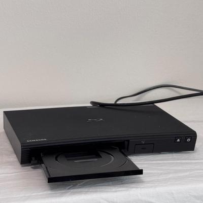 Samsung BD-J5700 Blue-Ray Player, GPX DVD/CD Player DH300B, and Several DVDs (B1-DZ)