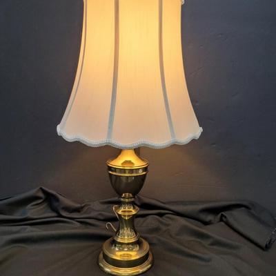 Sale Photo Thumbnail #40: Brass table lamp, 29 inches tall.  Silk shade.  very nice condition.
Very heavy.  
Retails  $85 to $200