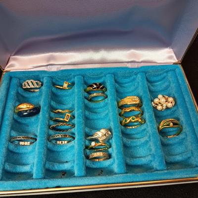 A VARIETY OF COSTUME RINGS AND A RING BOX