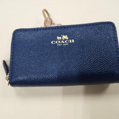 Sale Photo Thumbnail #171: Blue, 5 x 2 inches 
7 interior slots, 2 exterior zippered pockets 
excellent condition, new